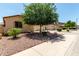 Attractive street view of homes with mature landscaping, xeriscaping, and sidewalks at 17937 W Westpark Blvd, Surprise, AZ 85388