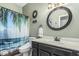 Cozy bathroom with a vanity and a shower/tub combination with a curtain at 20858 E Sonoqui Dr, Queen Creek, AZ 85142