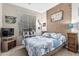 Nicely decorated bedroom featuring a queen bed with an ocean themed design at 20858 E Sonoqui Dr, Queen Creek, AZ 85142