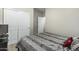 Bedroom with Queen bed and closet with bifold doors at 20858 E Sonoqui Dr, Queen Creek, AZ 85142