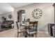 Dining area with furniture and a large wall clock at 20858 E Sonoqui Dr, Queen Creek, AZ 85142