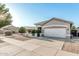 Inviting home with desert landscaping, two-car garage, and a well-maintained lawn at 20858 E Sonoqui Dr, Queen Creek, AZ 85142