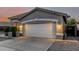 Charming single-story home featuring a two-car garage and desert landscaping at 20858 E Sonoqui Dr, Queen Creek, AZ 85142