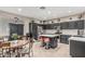 Kitchen featuring stainless steel appliances and red bar stools at the island at 20858 E Sonoqui Dr, Queen Creek, AZ 85142
