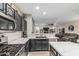 Kitchen with stainless steel appliances, island, and a pass through to the living room at 20858 E Sonoqui Dr, Queen Creek, AZ 85142
