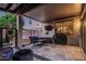 Covered patio with outdoor seating, grill, and fire pit at 20858 E Sonoqui Dr, Queen Creek, AZ 85142