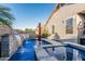 Stunning backyard pool with water features, spa, and elegant design, creating a private retreat at 20858 E Sonoqui Dr, Queen Creek, AZ 85142