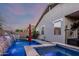 Backyard pool and spa area featuring a waterfall feature for relaxation and enjoyment at 20858 E Sonoqui Dr, Queen Creek, AZ 85142