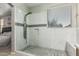 Modern shower features glass enclosure, white marble tile, and pebble flooring at 20858 E Sonoqui Dr, Queen Creek, AZ 85142