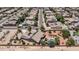 Panoramic aerial view of a neighborhood featuring a home with a private pool surrounded by mature landscaping at 2101 S 167Th Dr, Goodyear, AZ 85338
