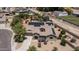 Stunning aerial view of a solar-paneled home with a lush backyard oasis, pool, and mature landscaping at 2101 S 167Th Dr, Goodyear, AZ 85338