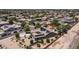 Home with solar panels, lush landscaping, and backyard entertaining areas at 2101 S 167Th Dr, Goodyear, AZ 85338