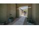 Charming courtyard entrance featuring manicured landscaping, a stone walkway, and a decorative water feature at 2101 S 167Th Dr, Goodyear, AZ 85338