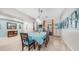 Inviting dining room with ample natural light, table with seating for six, and modern decor at 2101 S 167Th Dr, Goodyear, AZ 85338