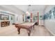 Entertaining game room with a pool table and a relaxing chair at 2101 S 167Th Dr, Goodyear, AZ 85338
