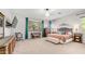 Spacious main bedroom with carpet, a ceiling fan, and a decorative headboard at 2101 S 167Th Dr, Goodyear, AZ 85338