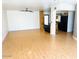 Spacious living room with wood floors, ceiling fan and adjoins kitchen at 2103 W Missouri Ave, Phoenix, AZ 85015