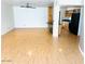 Spacious living room with light wood floors and natural light streaming in at 2103 W Missouri Ave, Phoenix, AZ 85015