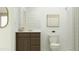 Stylish bathroom featuring a vanity with a dark wood cabinet, a framed mirror, and a shower with a curtain at 23073 E Saddle Way, Queen Creek, AZ 85142