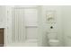 This bathroom features a white tile shower, a toilet, and a neutral color scheme at 23073 E Saddle Way, Queen Creek, AZ 85142