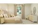 Serene bedroom featuring a comfortable bed, stylish lighting, and a cozy reading chair at 23073 E Saddle Way, Queen Creek, AZ 85142