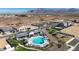 Beautiful community pool with mountain views surrounded by lush landscaping at 2583 E Music Mountain Ave, Apache Junction, AZ 85119