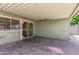Covered backyard patio area with access to the home through a security door at 2645 W Elm St, Phoenix, AZ 85017