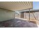 Covered backyard patio area with a gate to the yard at 2645 W Elm St, Phoenix, AZ 85017