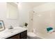 Bathroom vanity with sink, mirror, shower-tub combination, and toilet at 2645 W Elm St, Phoenix, AZ 85017