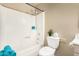 Neutral bathroom showcasing a shower-tub combination, toilet, and neutral color scheme at 2645 W Elm St, Phoenix, AZ 85017