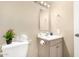 Bathroom showcasing a vanity with sink, toilet, mirror, and stylish decorations at 2645 W Elm St, Phoenix, AZ 85017