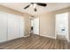Large bedroom with wood-look floors connects to a bathroom and closet at 2645 W Elm St, Phoenix, AZ 85017