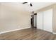 Bright bedroom with wood-look floors and large closet doors at 2645 W Elm St, Phoenix, AZ 85017