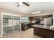 Kitchen features dark cabinets, modern appliances, tile floors, and glass door to backyard at 2645 W Elm St, Phoenix, AZ 85017