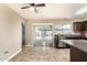 Kitchen features dark cabinets, stainless steel appliances, tile floors, and an adjacent dining area at 2645 W Elm St, Phoenix, AZ 85017