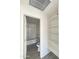 Bathroom with tub/shower, gray vanity, open shelves, and new flooring at 2724 W Highland Ave, Phoenix, AZ 85017