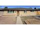 Charming single-story home featuring a neutral-toned exterior, well-maintained lawn, and inviting front entrance at 2724 W Highland Ave, Phoenix, AZ 85017