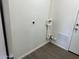 A laundry room with laminate flooring and modern electric outlets at 2724 W Highland Ave, Phoenix, AZ 85017
