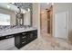 Modern bathroom with decorative tile, updated vanity, mirror, and glass enclosed shower at 3114 E Capricorn Way, Chandler, AZ 85249