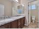Bright bathroom with double sinks, granite counters, and a separate toilet room at 3114 E Capricorn Way, Chandler, AZ 85249