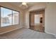 Comfortable bedroom with carpeted floors, a large window, and an open doorway at 3114 E Capricorn Way, Chandler, AZ 85249