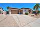 Spacious home with a three-car garage, desert landscaping, and a charming front exterior at 3114 E Capricorn Way, Chandler, AZ 85249
