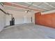 Spacious two car garage featuring sealed floors and built in cabinets for storage at 3114 E Capricorn Way, Chandler, AZ 85249