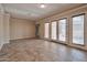 Large living room featuring tile floors, french doors, neutral colors, and a spacious floor plan at 3114 E Capricorn Way, Chandler, AZ 85249