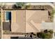 A bird's eye view of a home showing the roof, pool and outdoor living space at 31311 N 138Th Ave, Peoria, AZ 85383