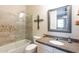 Bathroom with a tub and shower combo, granite countertops, and custom decor at 31311 N 138Th Ave, Peoria, AZ 85383