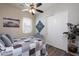Comfortable bedroom with a ceiling fan, plantation shutters, and a closet at 31311 N 138Th Ave, Peoria, AZ 85383