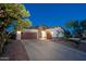Charming single-Gathering home with a well-manicured yard, three-car garage, and stone accents at 31311 N 138Th Ave, Peoria, AZ 85383