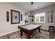 Game Room with pool table and a decorative light fixture at 31311 N 138Th Ave, Peoria, AZ 85383