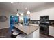 Modern kitchen with granite countertops, stainless steel appliances, and a center island at 31311 N 138Th Ave, Peoria, AZ 85383